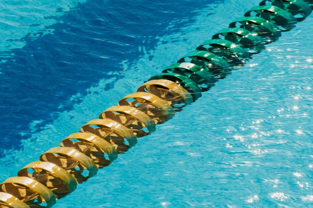Yellow and green swimming lane in a blue pool