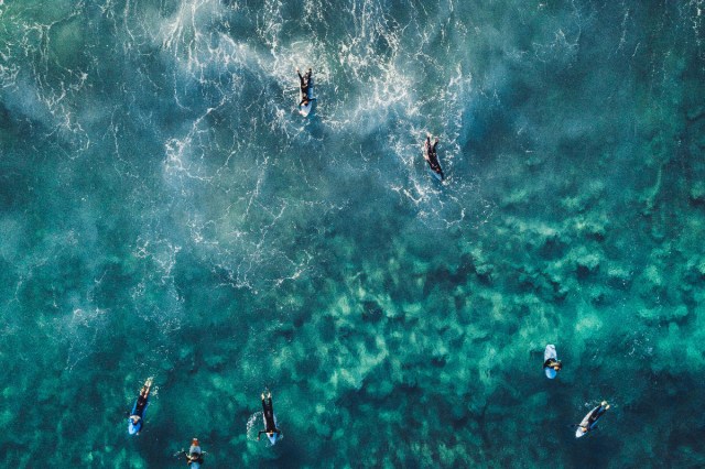 Overhead picture of people surfing in the ocean