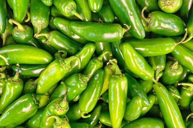 A pile of green chili peppers