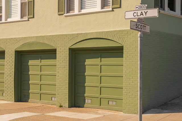 A sidewalk and street signs