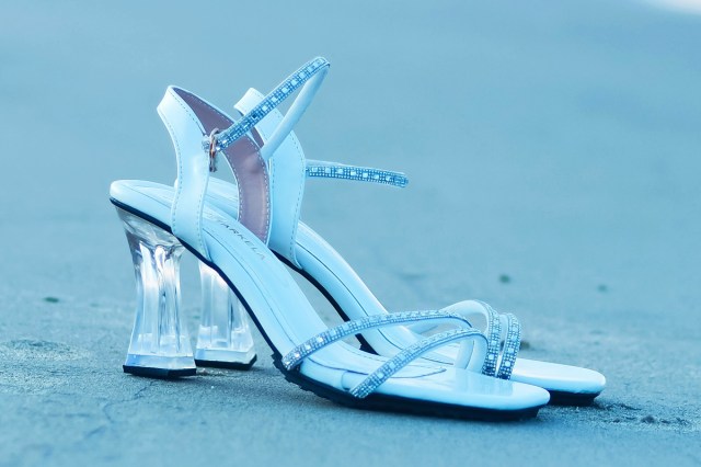 A pair of high heels on a beach 