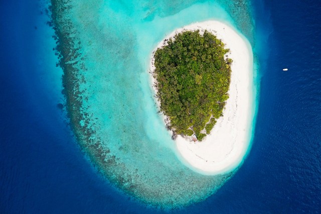 Aerial view of an island surrounded by blue waters