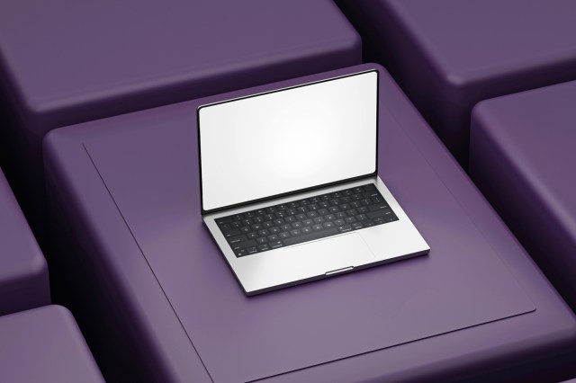 An open laptop on purple blocks