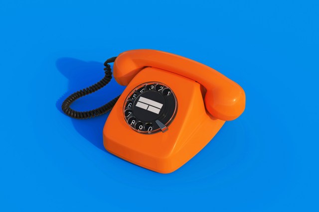 A rotary phone of a blue background