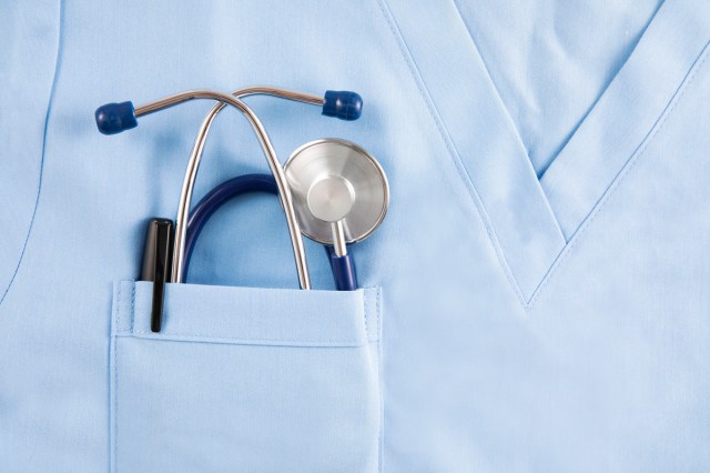 A stethoscope in a doctors shirt pocket