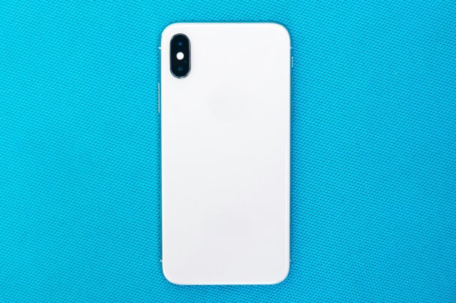 An iPhone on a blue background