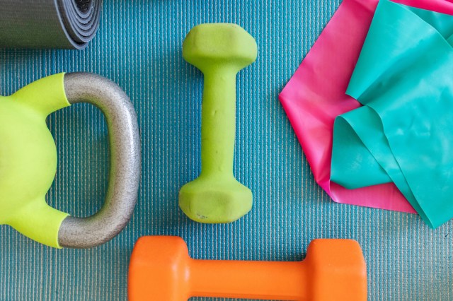 Workout equipment on a blue yoga mat