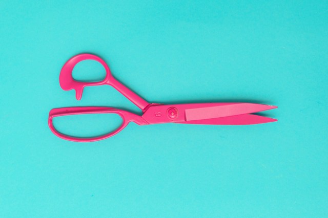 A pair of bright pink scissors